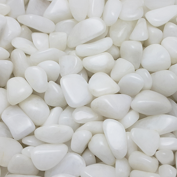 A tumbled piece of Snow Quartz showing its soft, cloudy white color and semi-opaque texture