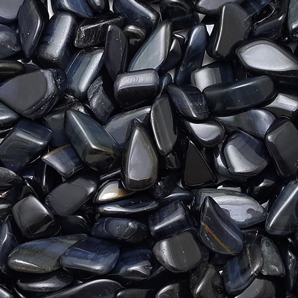 Polished steel-blue Blue Tiger's Eye stone with a silvery band of light moving across fine parallel fibers