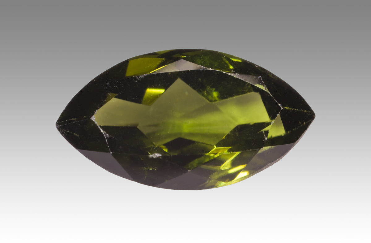 Faceted green Diopside gemstone showing clarity and brilliance