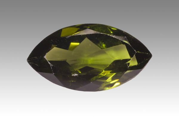 Faceted green Diopside gemstone showing clarity and brilliance