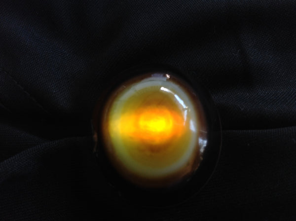 Banded red and white Sardonyx specimen shown backlit