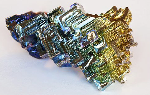 Iridescent Bismuth crystal with rainbow stair-step formation
