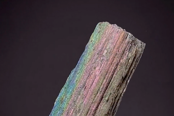 Natural iridescent hematite specimen from Andrade Mine in Brazil displaying rainbow surface coloration