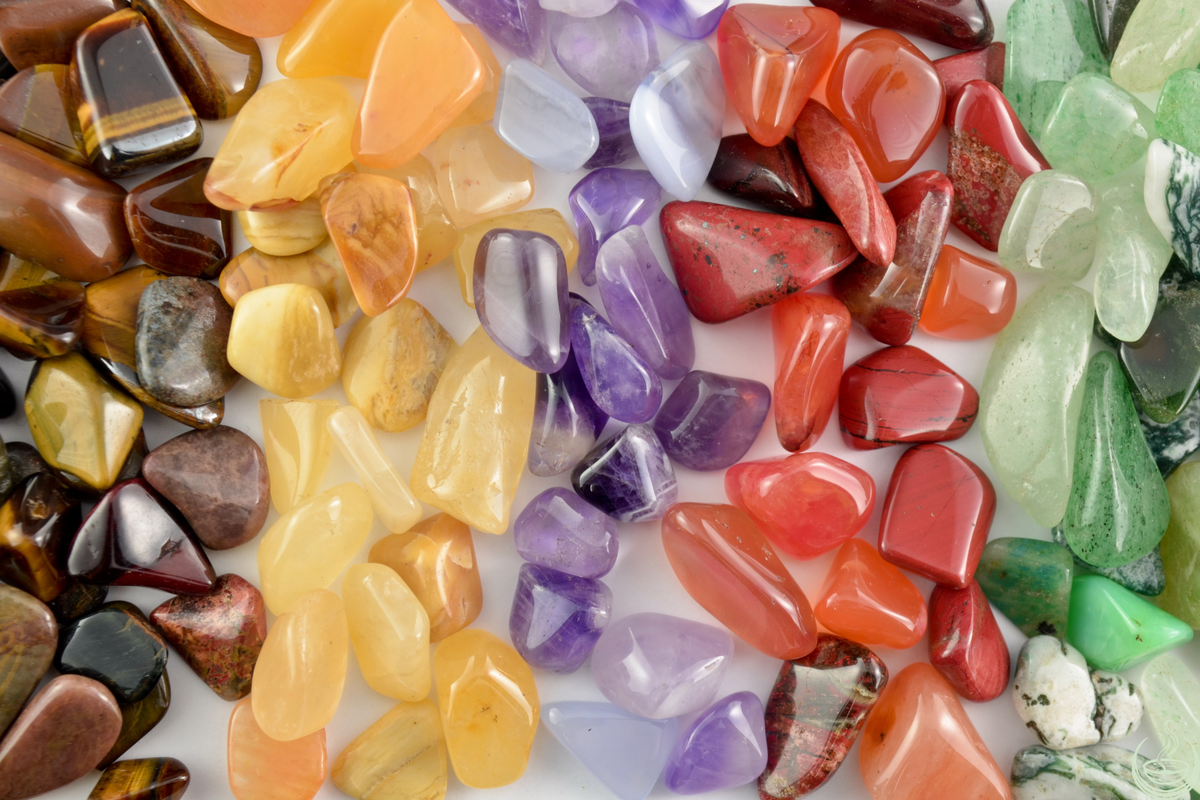 A mixed pile of colorful tumbled stones