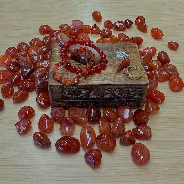 	•	Orange-red Carnelian gemstone glowing with vitality and grounding energy.
