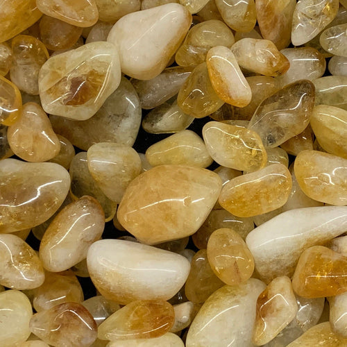 Golden Citrine quartz point with honey-yellow clarity symbolizing prosperity and joy.