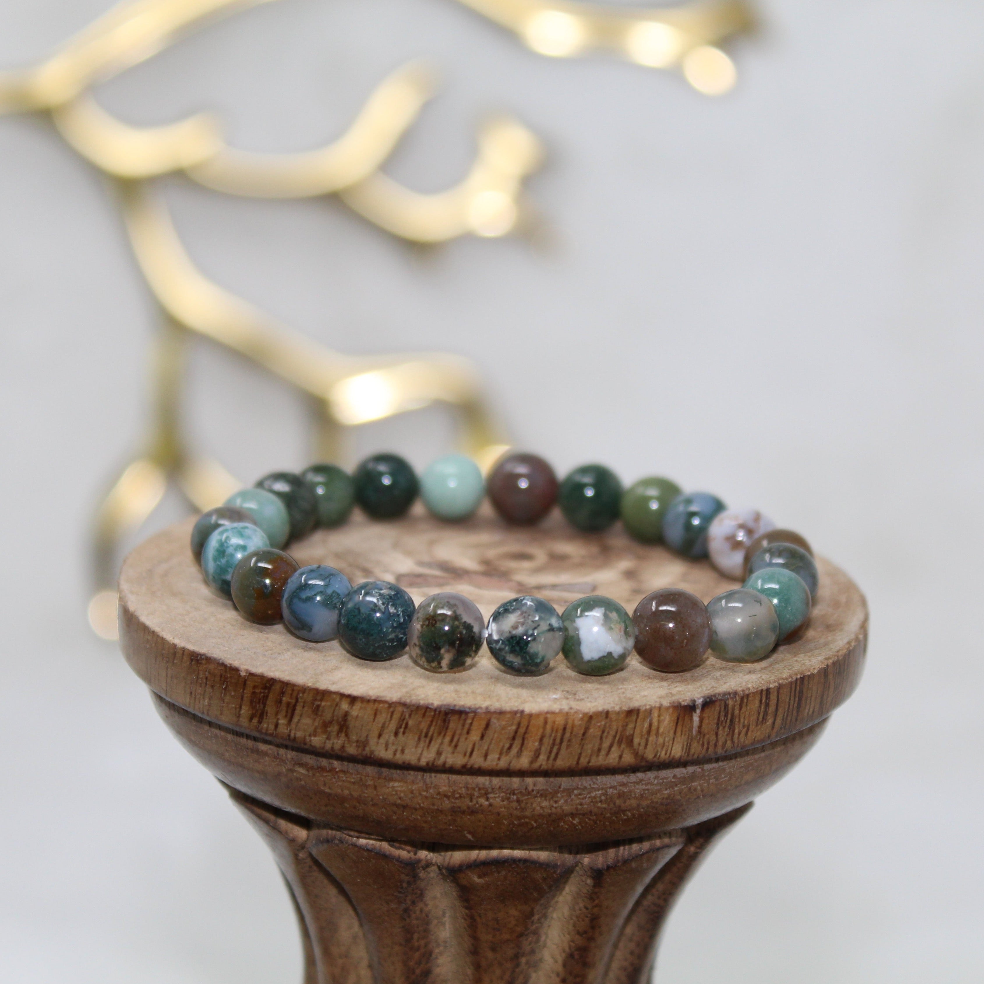 Polished India Agate stone with earthy green and brown banding