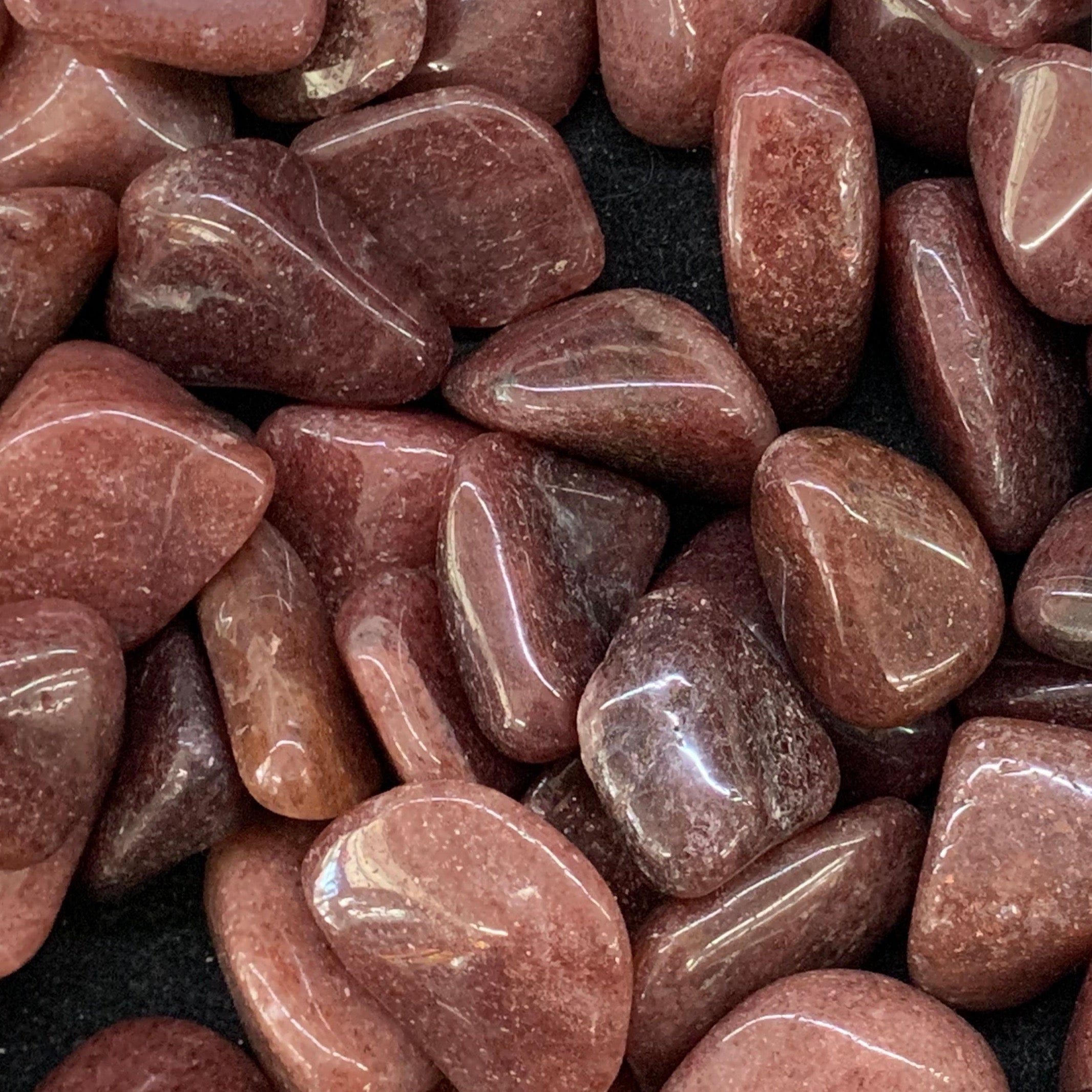 Polished red aventurine stone with deep earthy red tones