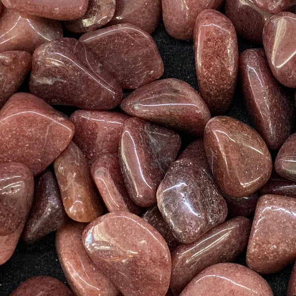 Polished red aventurine stone with deep earthy red tones