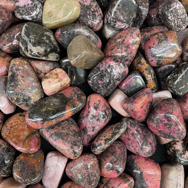 Pink and black Rhodonite crystal with heart-healing energy