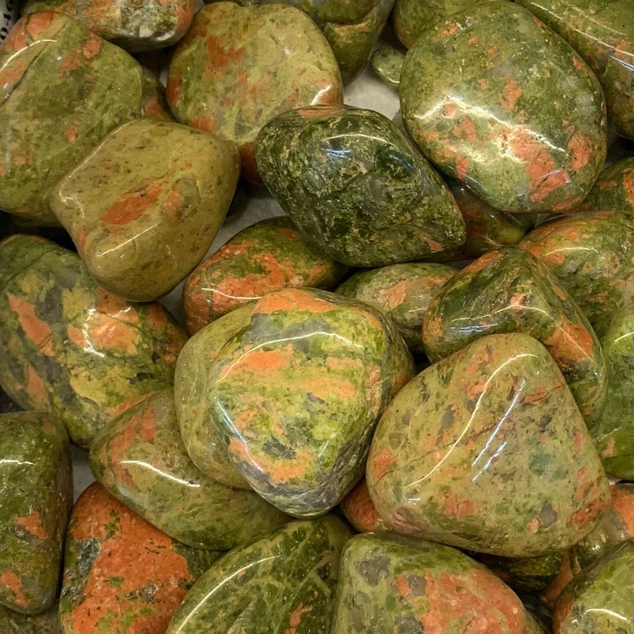 Mossy green and pink Unakite crystal with soft earthy tones, polished for healing use