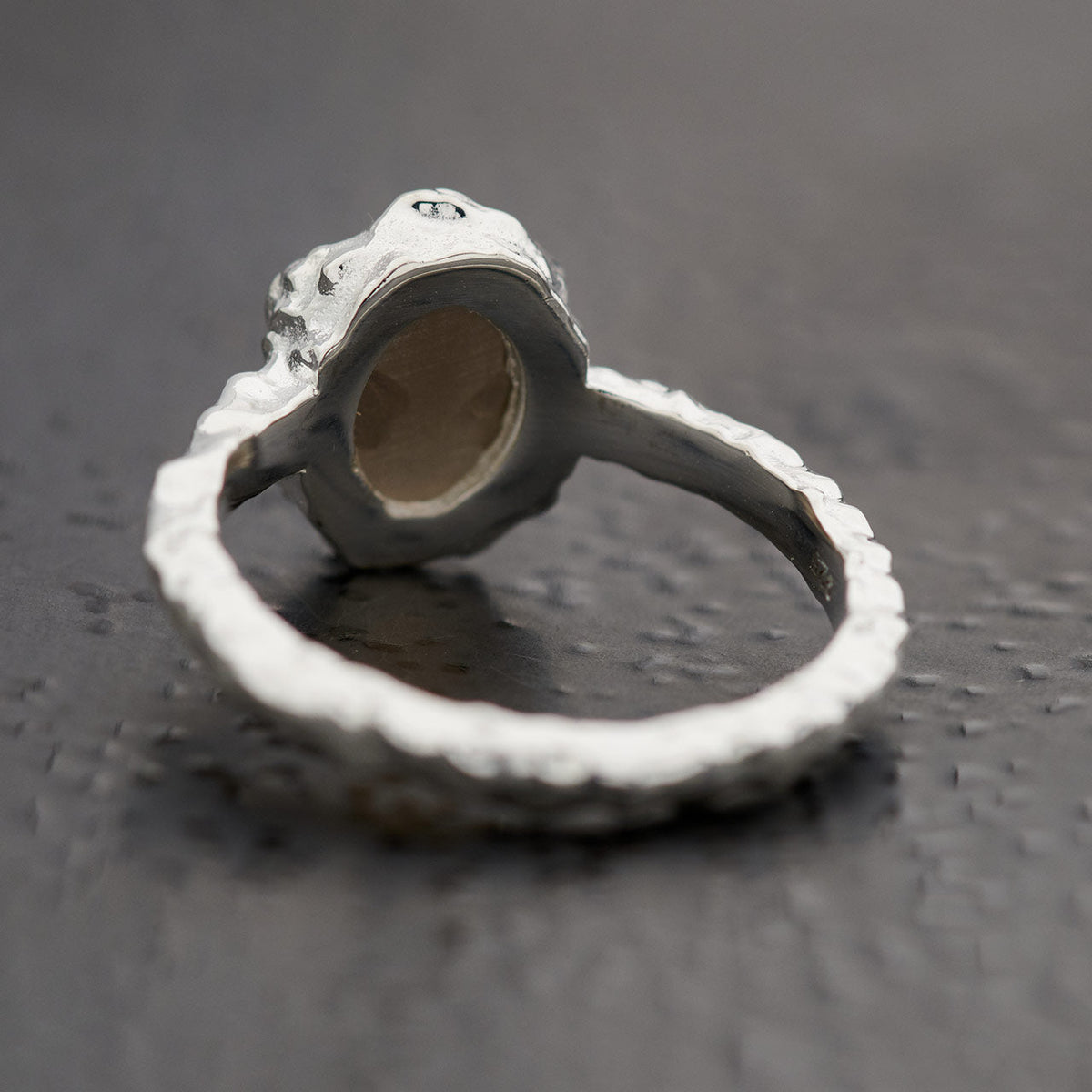 Back of oval smoky quartz ring in hammered sterling silver