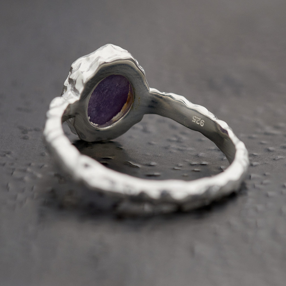 Back of oval lepidolite ring in hammered sterling silver