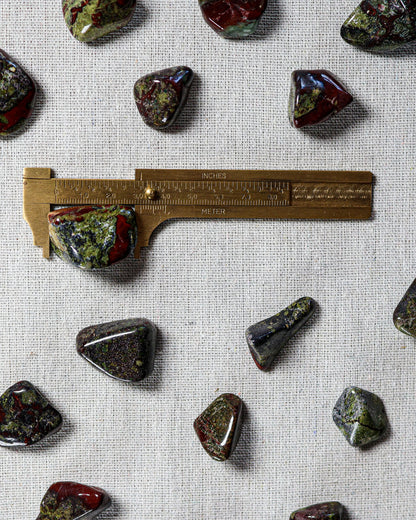 Dragon Blood Jasper Tumbled Gemstone – Sage Spirits, shown with ruler for size