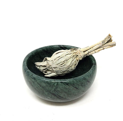 Green marble bowl with a sage bundle