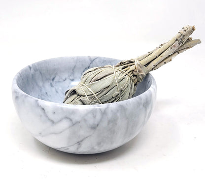White marble bowl with a sage bundle