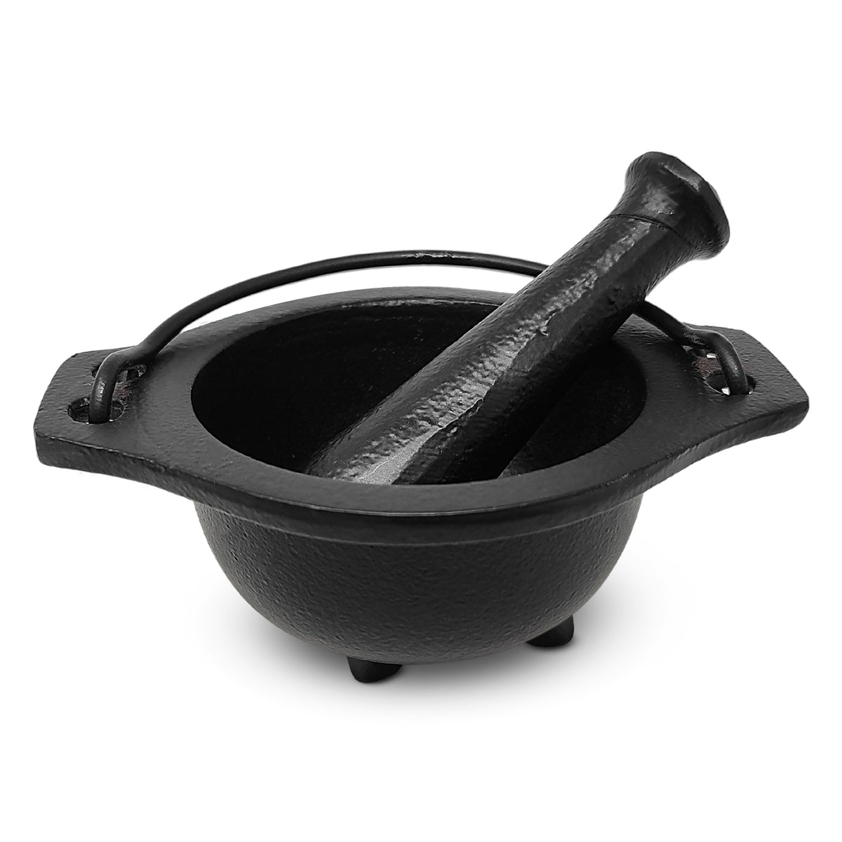 Black cast iron cauldron with pestle